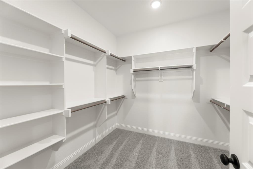 3916 Keya Drive Prosper, TX 75078 - Photo 24 of 28 a view of walk in closet with empty racks