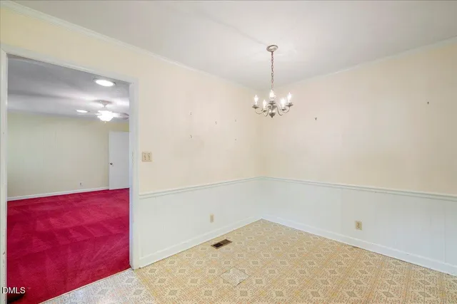 a view of a livingroom with a chandelier fan