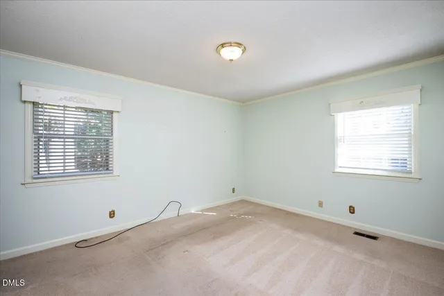 a room with a window and a ceiling fan