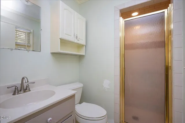 a bathroom with a sink toilet and vanity