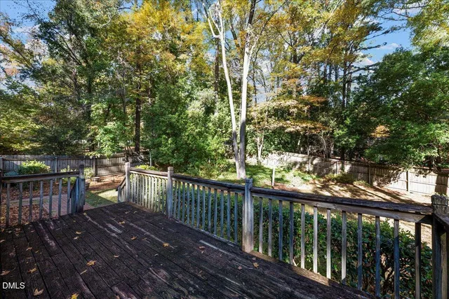 a view of a balcony with wooden floor