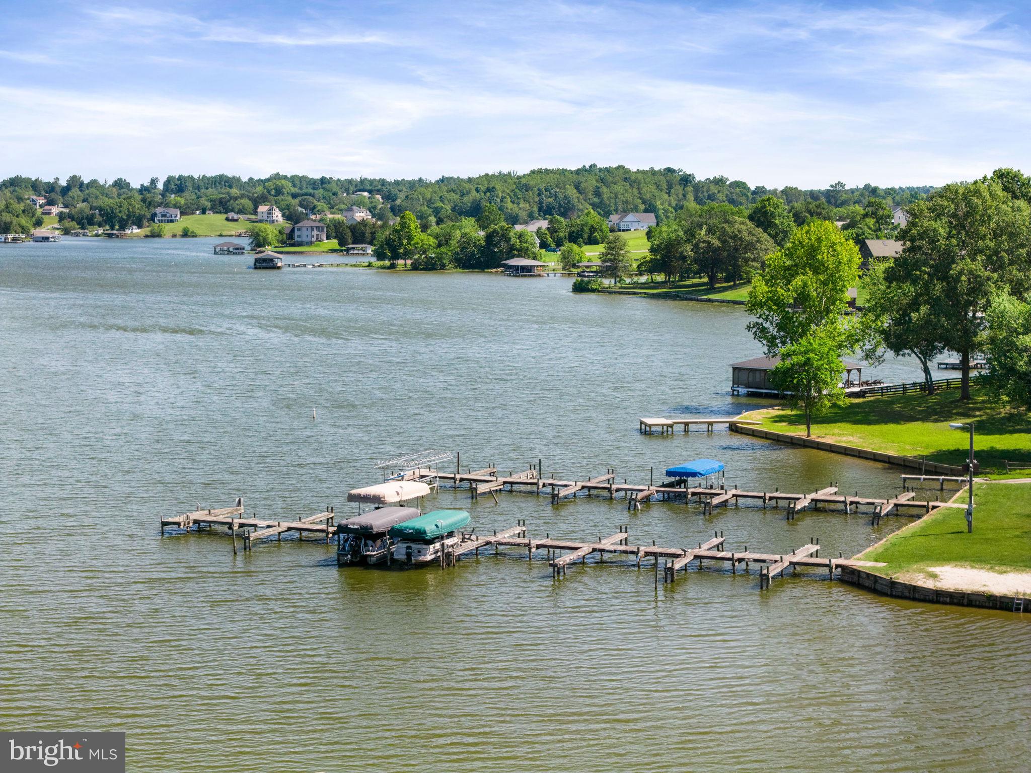161 Troy Road Louisa, VA 23093 - Photo 50 of 60 a view of water with boats and trees in the background