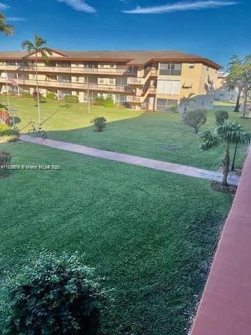 a view of swimming pool with outdoor space and seating area
