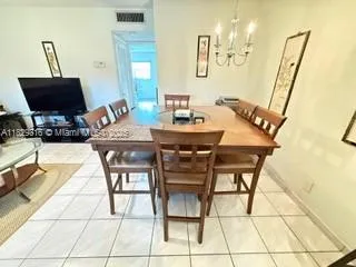 a bathroom with a sink mirror and toilet