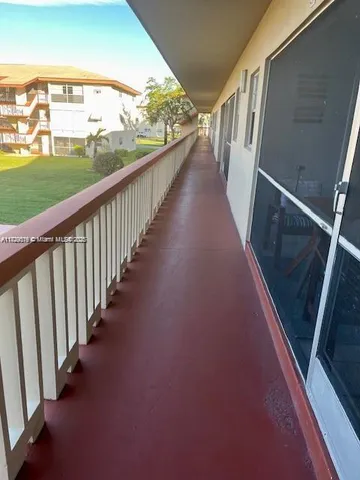 a view of a lake with a house in the background