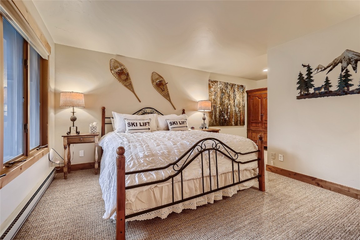 22280 Highway 6, Unit 1709 Keystone, CO 80435 - Photo 13 of 49 Spacious primary bedroom with cozy mountain dcor and natural light.