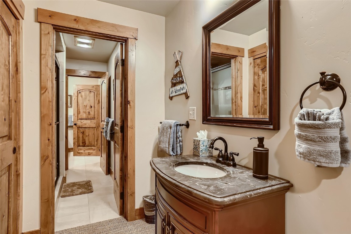 22280 Highway 6, Unit 1709 Keystone, CO 80435 - Photo 15 of 49 Primary bedroom with sink area and direct access to bathroom.