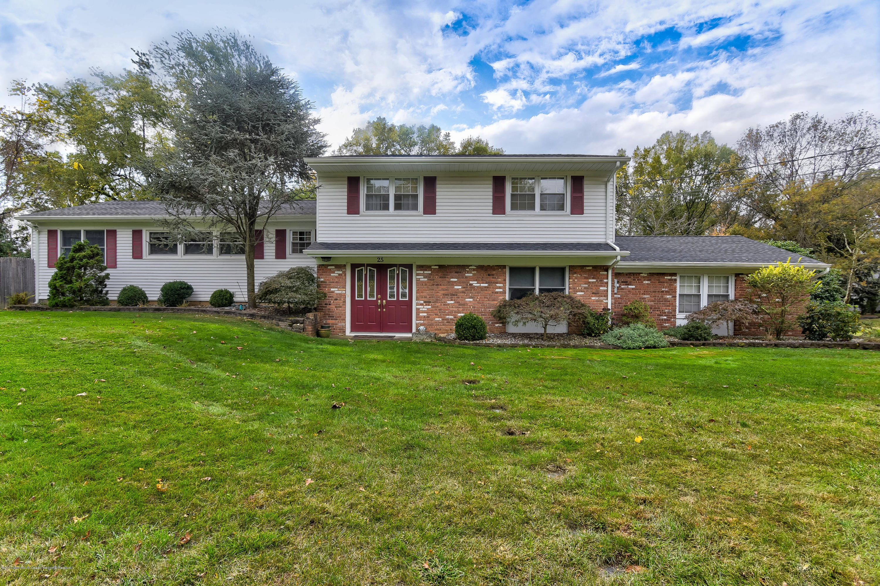 25 Gull Road Middletown, NJ 07748 - Photo 1 of 38 a view of a yard in front of a house
