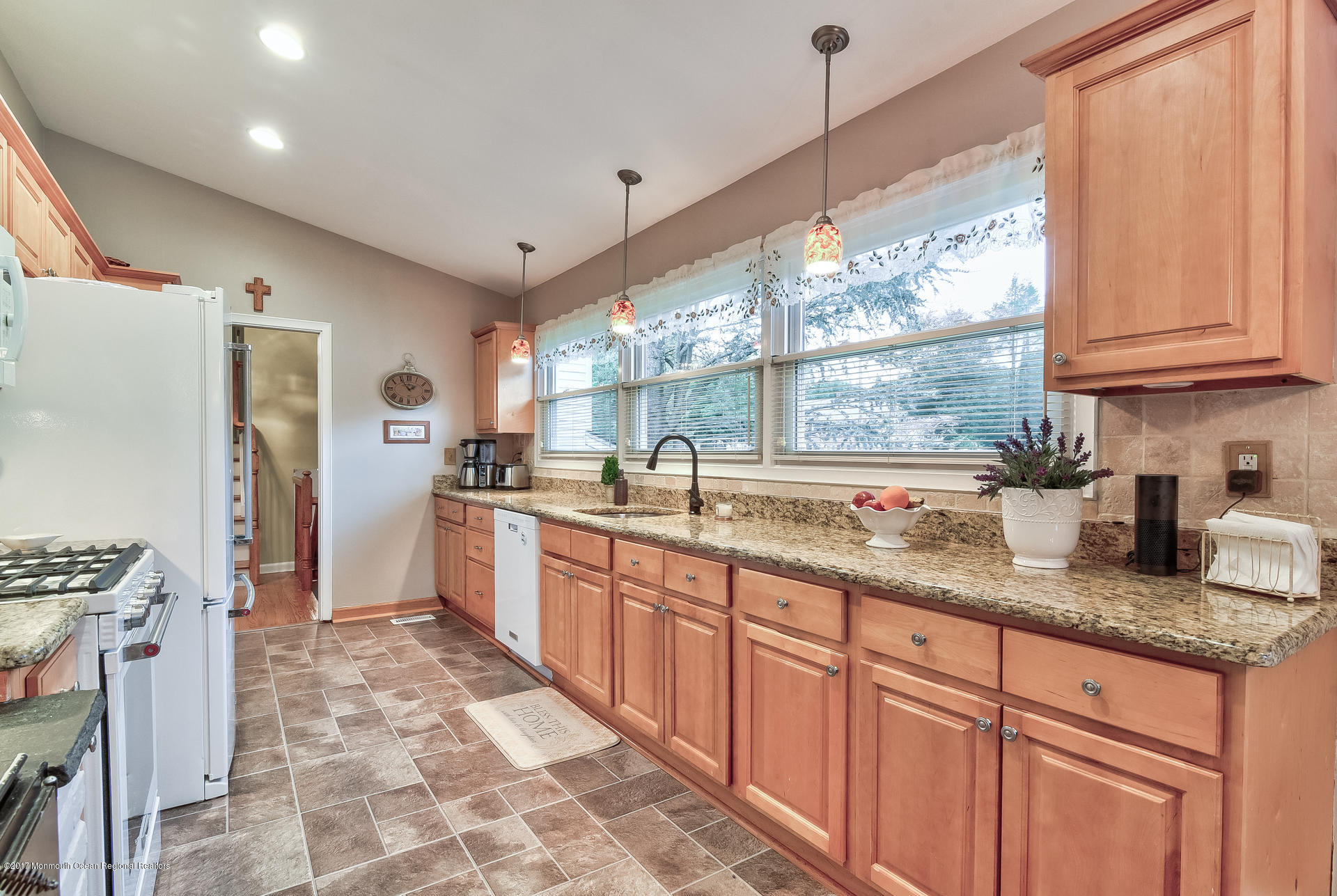 25 Gull Road Middletown, NJ 07748 - Photo 11 of 38 a kitchen with granite countertop a sink stainless steel appliances and cabinets
