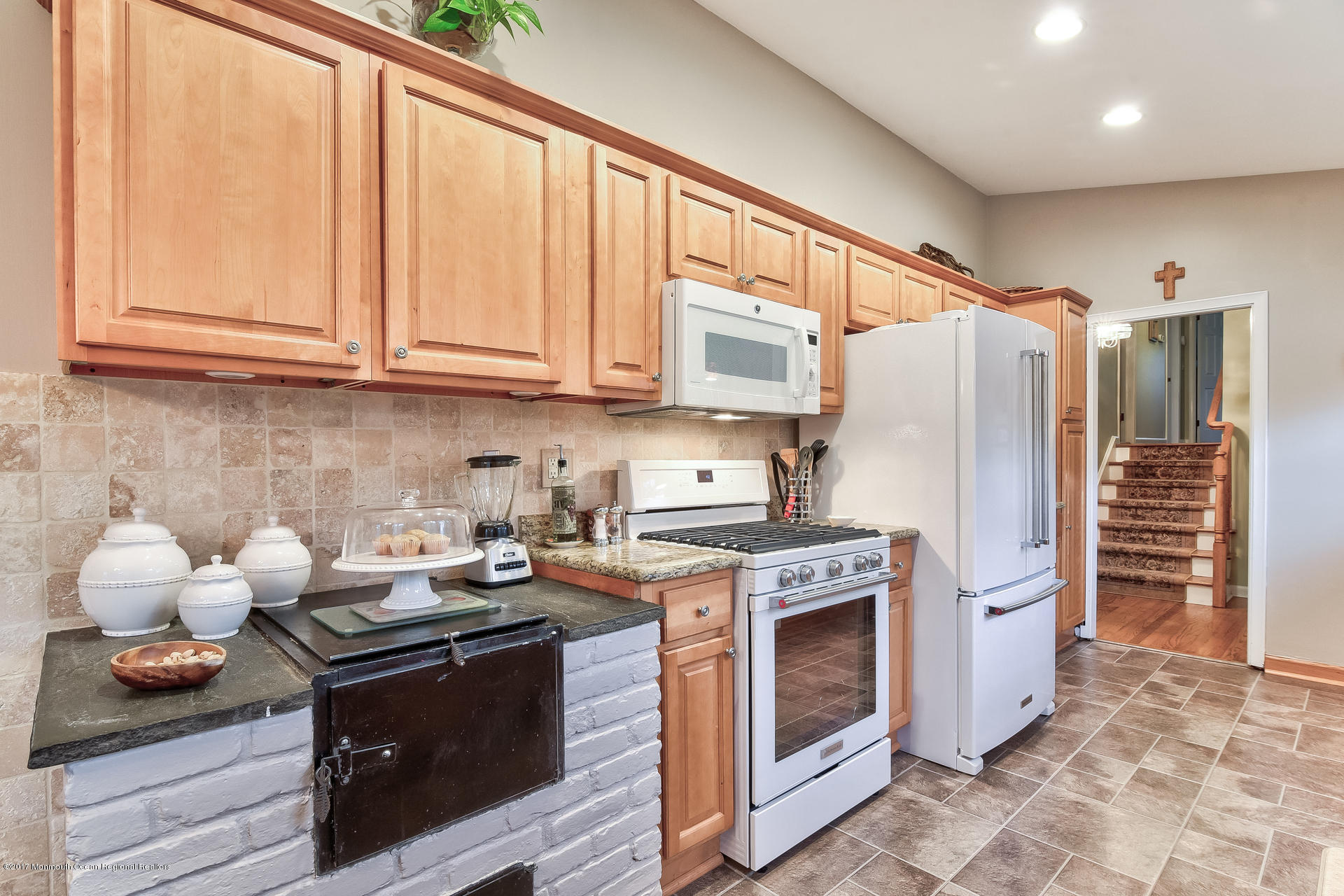 25 Gull Road Middletown, NJ 07748 - Photo 12 of 38 a kitchen with stainless steel appliances granite countertop a stove a refrigerator and a refrigerator