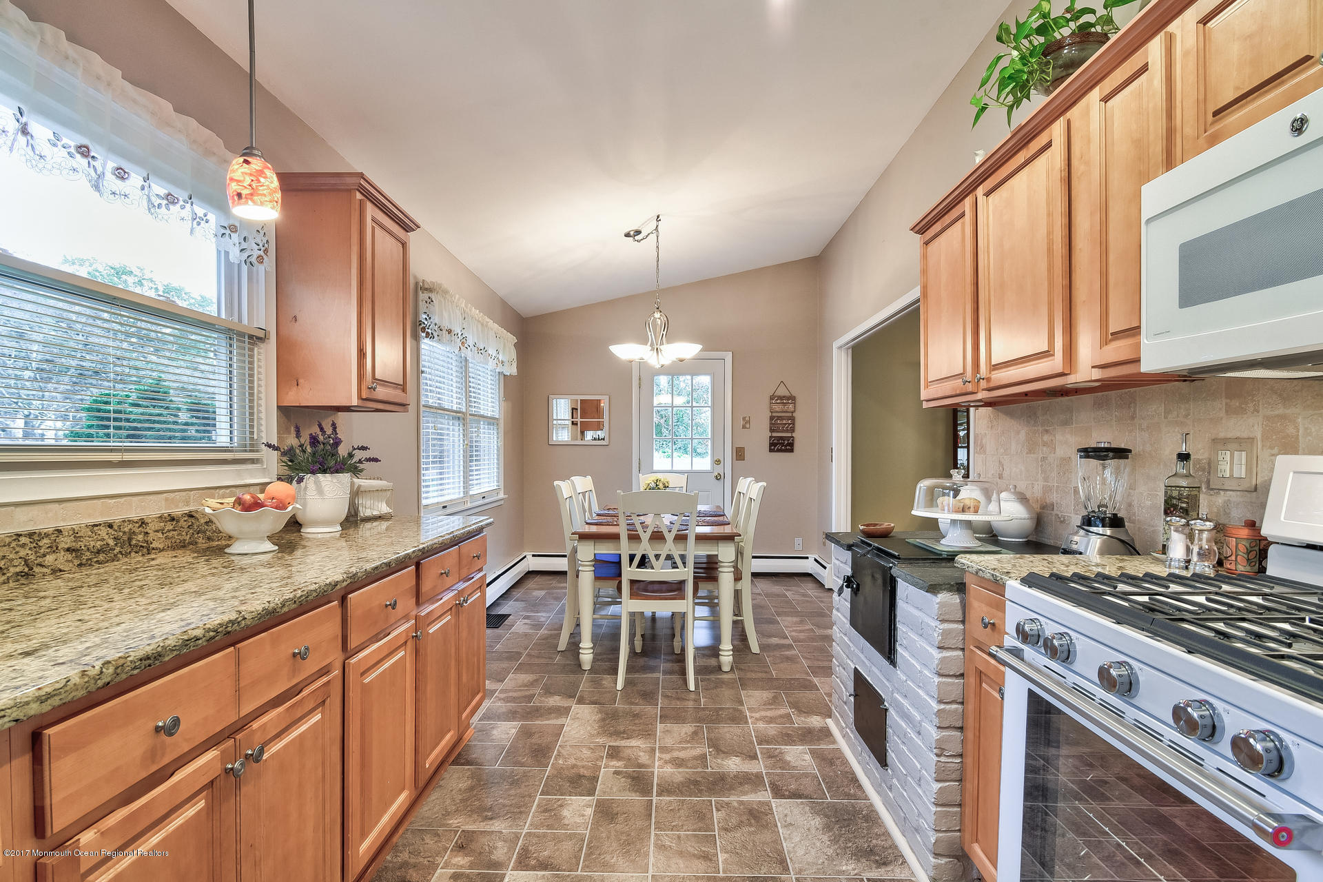 25 Gull Road Middletown, NJ 07748 - Photo 13 of 38 a kitchen with sink stove and cabinets