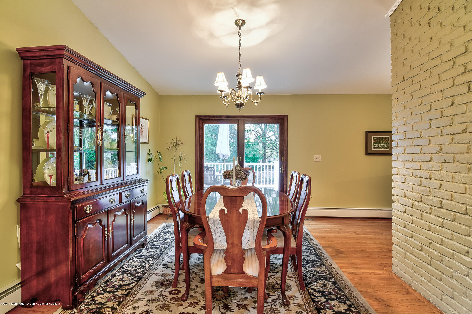 25 Gull Road Middletown, NJ 07748 - Photo 14 of 38 a dining room with furniture a chandelier and wooden floor