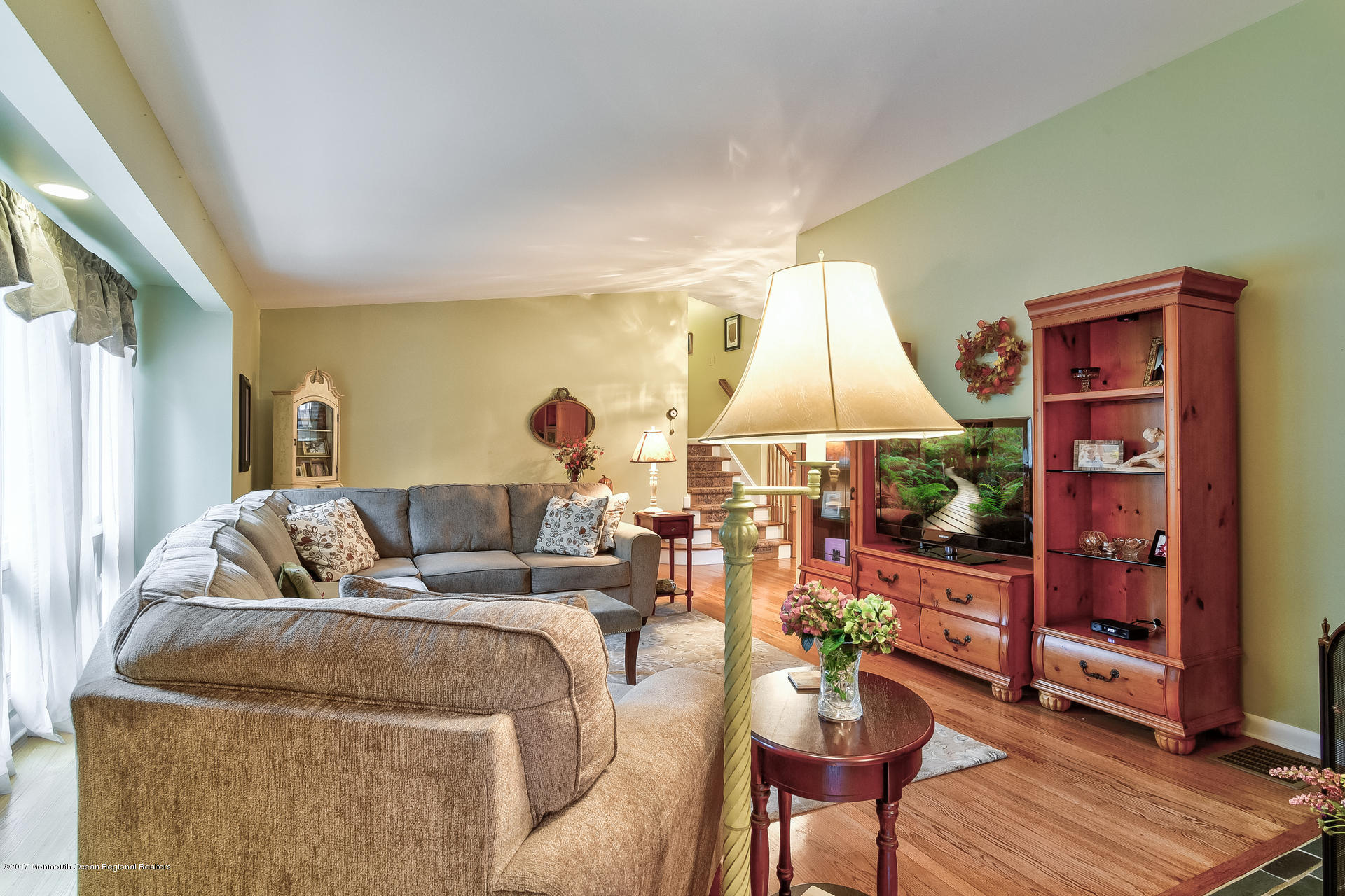 25 Gull Road Middletown, NJ 07748 - Photo 22 of 38 a living room with furniture and a flat screen tv