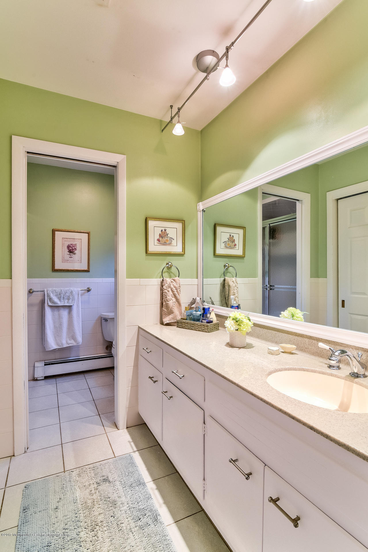 25 Gull Road Middletown, NJ 07748 - Photo 29 of 38 a spacious bathroom with a granite countertop sink and a mirror