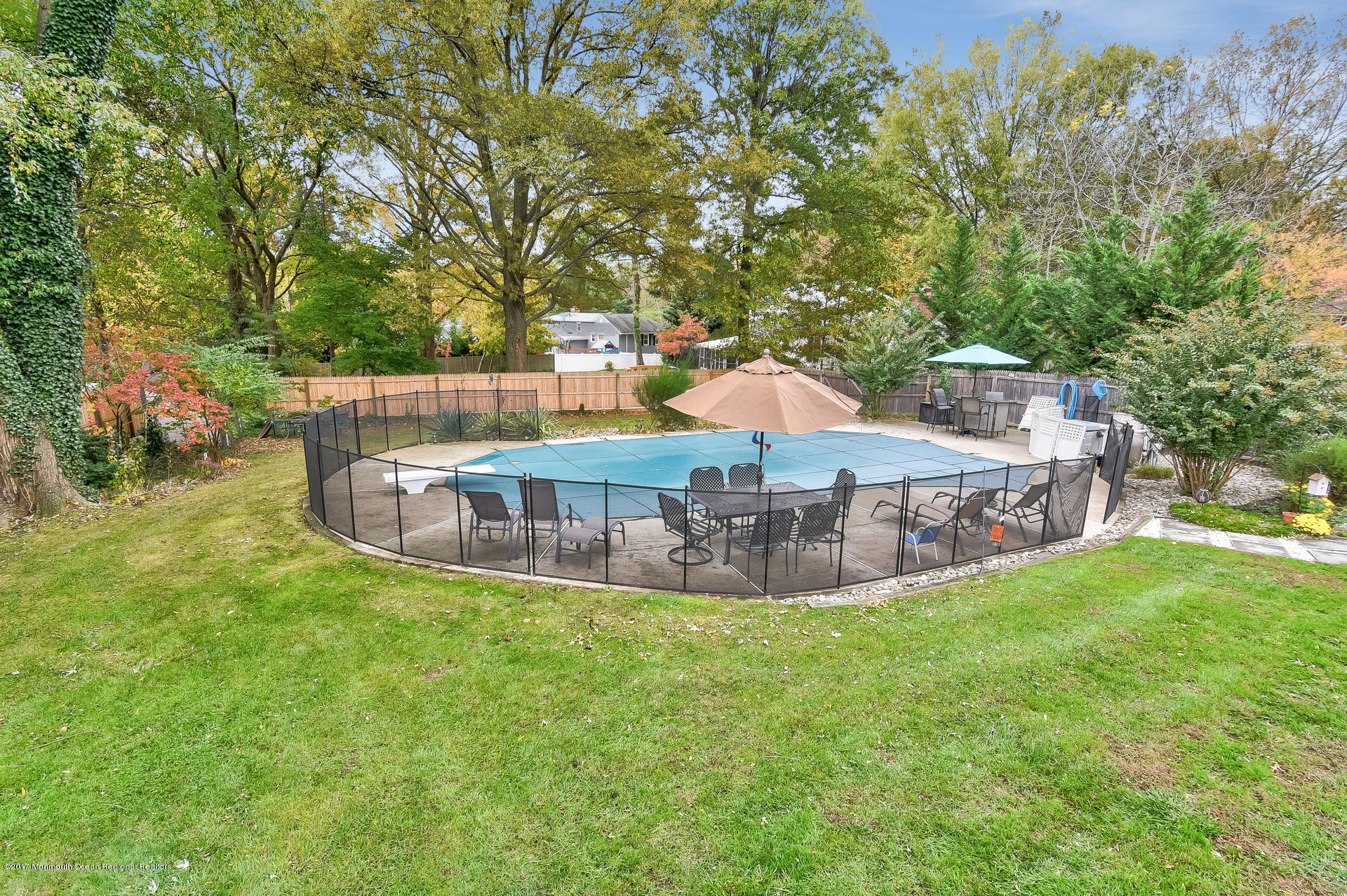 25 Gull Road Middletown, NJ 07748 - Photo 32 of 38 a view of a house with a backyard and a patio