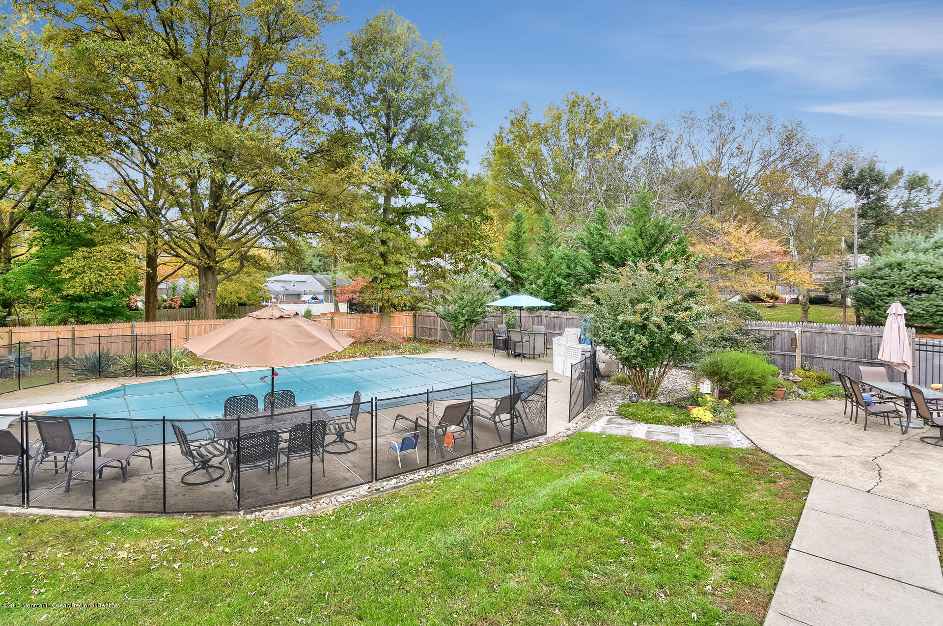 25 Gull Road Middletown, NJ 07748 - Photo 33 of 38 a view of a house with garden and a patio