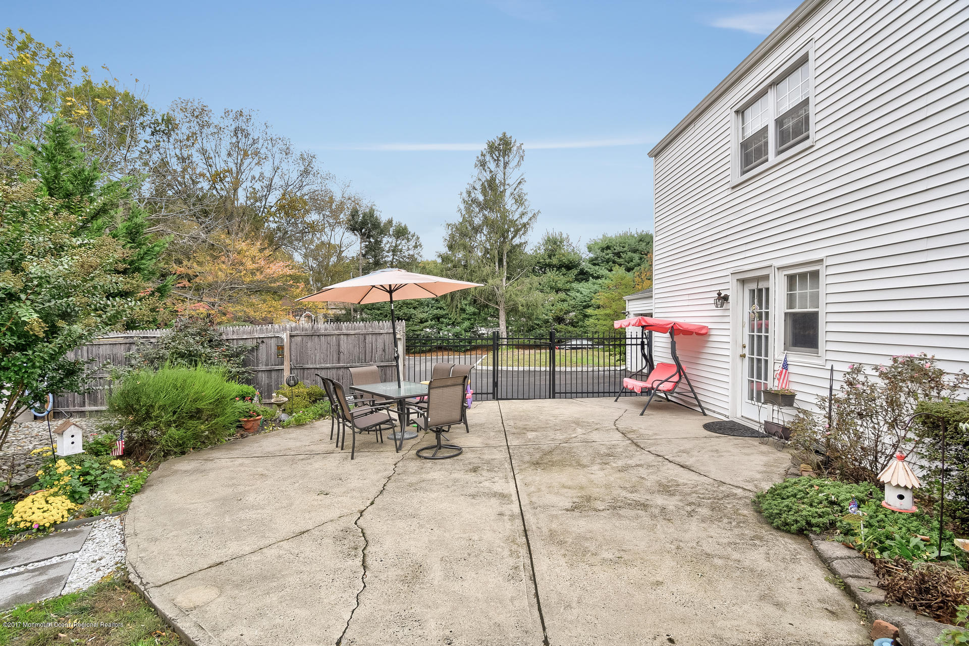 25 Gull Road Middletown, NJ 07748 - Photo 34 of 38 a backyard of a house with table and chairs