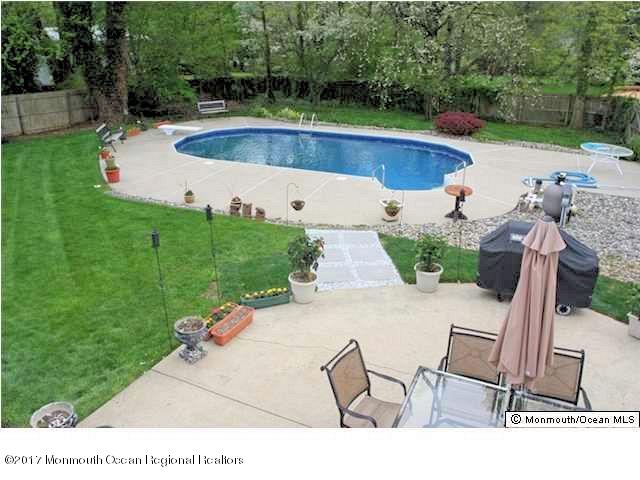 25 Gull Road Middletown, NJ 07748 - Photo 36 of 38 a view of a backyard with swimming pool