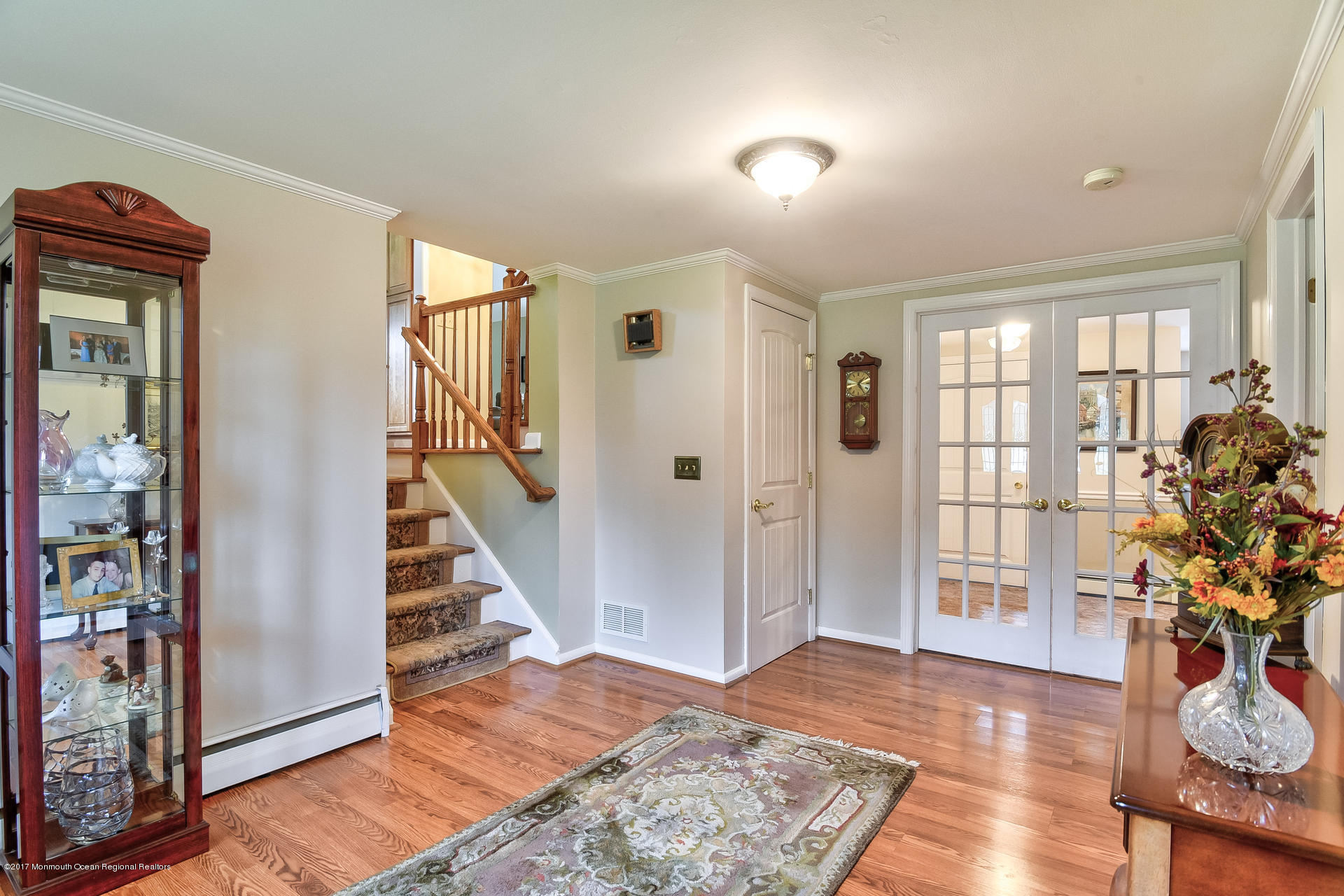 25 Gull Road Middletown, NJ 07748 - Photo 4 of 38 a view of entryway with wooden floor and stairs