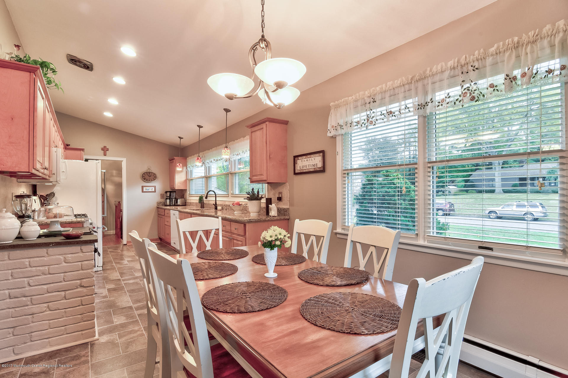 25 Gull Road Middletown, NJ 07748 - Photo 10 of 38 a view of a dining room with furniture a chandelier and large windows