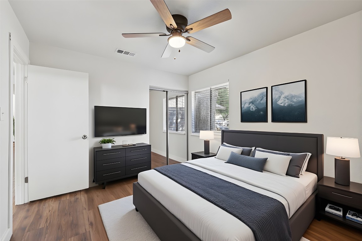 602 Old Stone Road Austin, TX 78745 - Photo 15 of 28 a bedroom with a bed and a flat screen tv