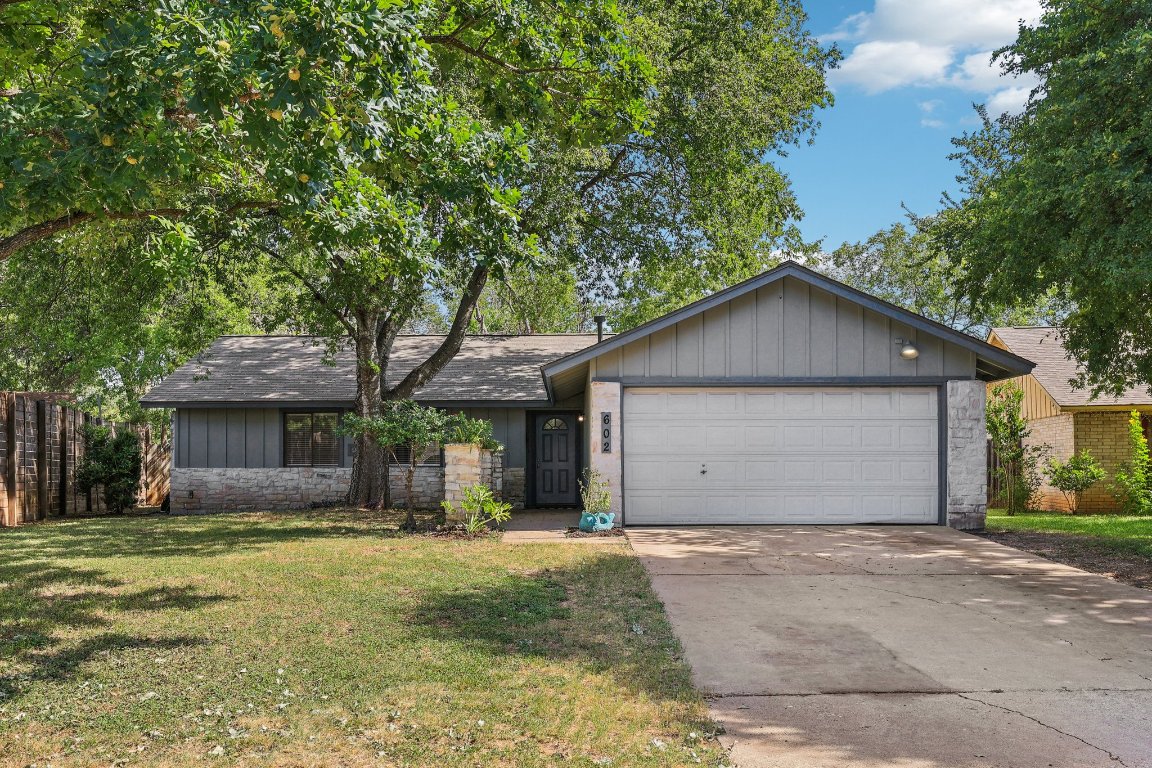602 Old Stone Road Austin, TX 78745 - Photo 24 of 28 a front view of house with yard and trees around