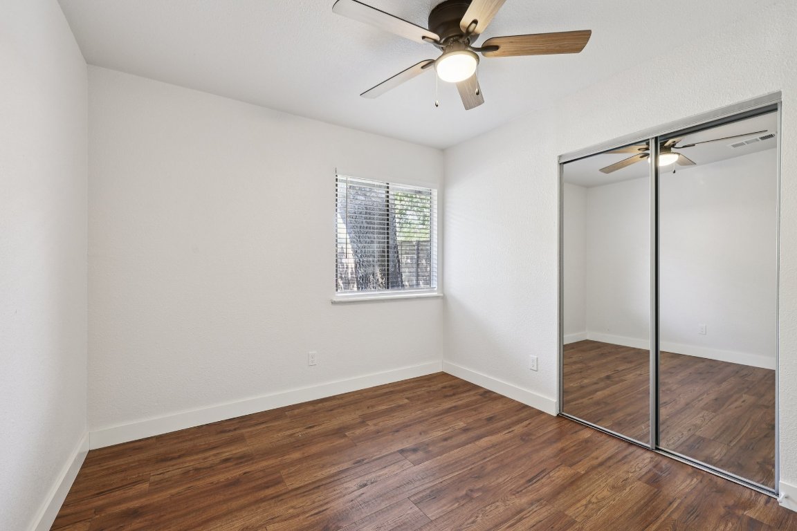 602 Old Stone Road Austin, TX 78745 - Photo 26 of 28 wooden floor in an empty room with a window