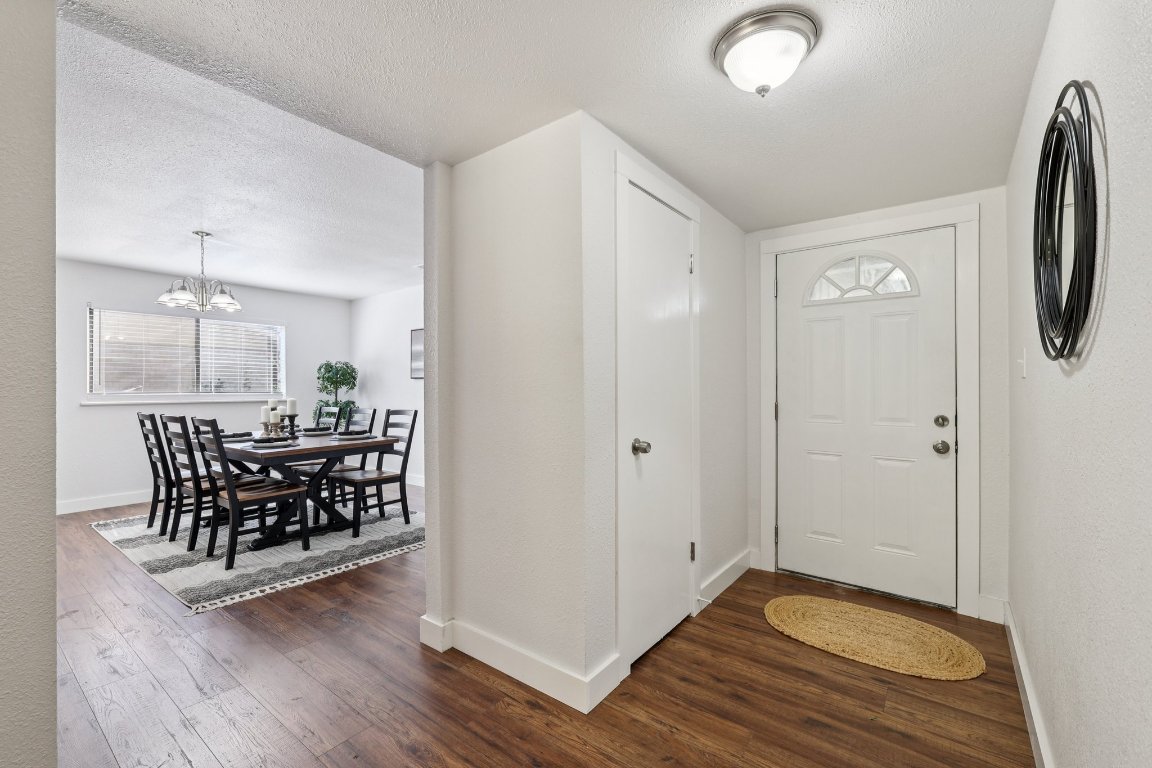 602 Old Stone Road Austin, TX 78745 - Photo 6 of 28 a view of a hallway with wooden floor