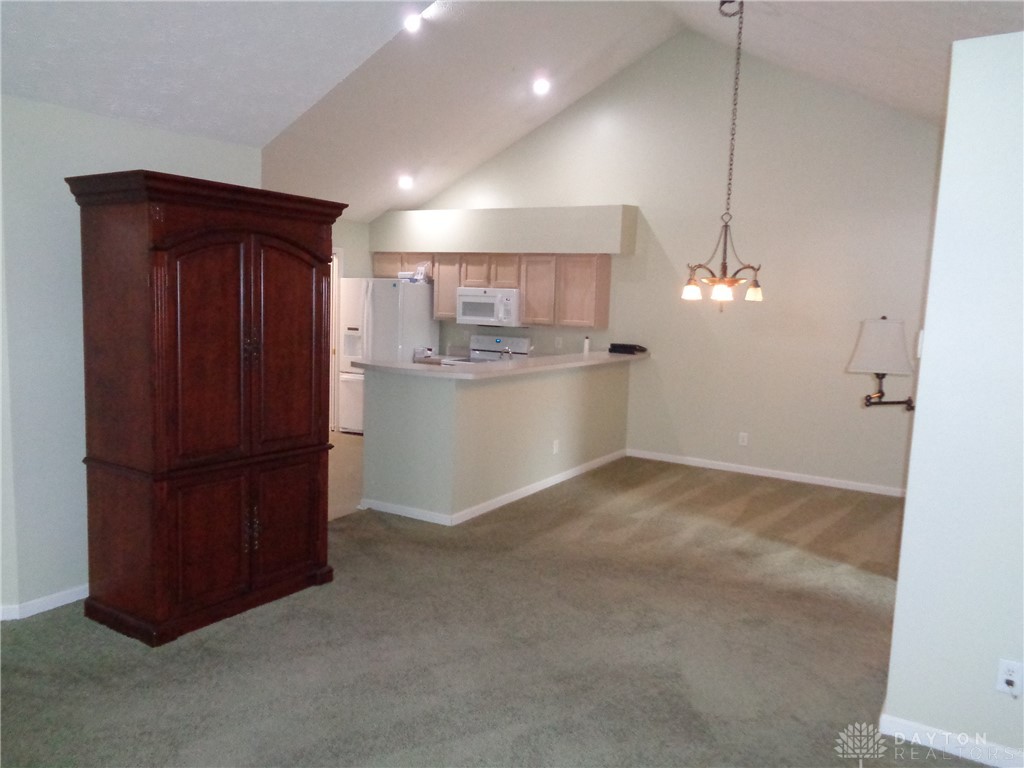 80 Villa Pointe Drive Springboro, OH 45066 - Photo 7 of 19 This inviting space features an open layout with soaring vaulted ceilings.
