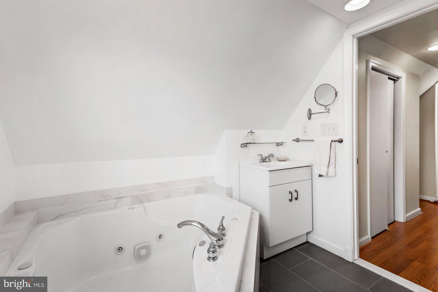 1902 Fairbank Road Baltimore, MD 21209 - Photo 27 of 48 Primary suite with soaking tub and walk-in shower
