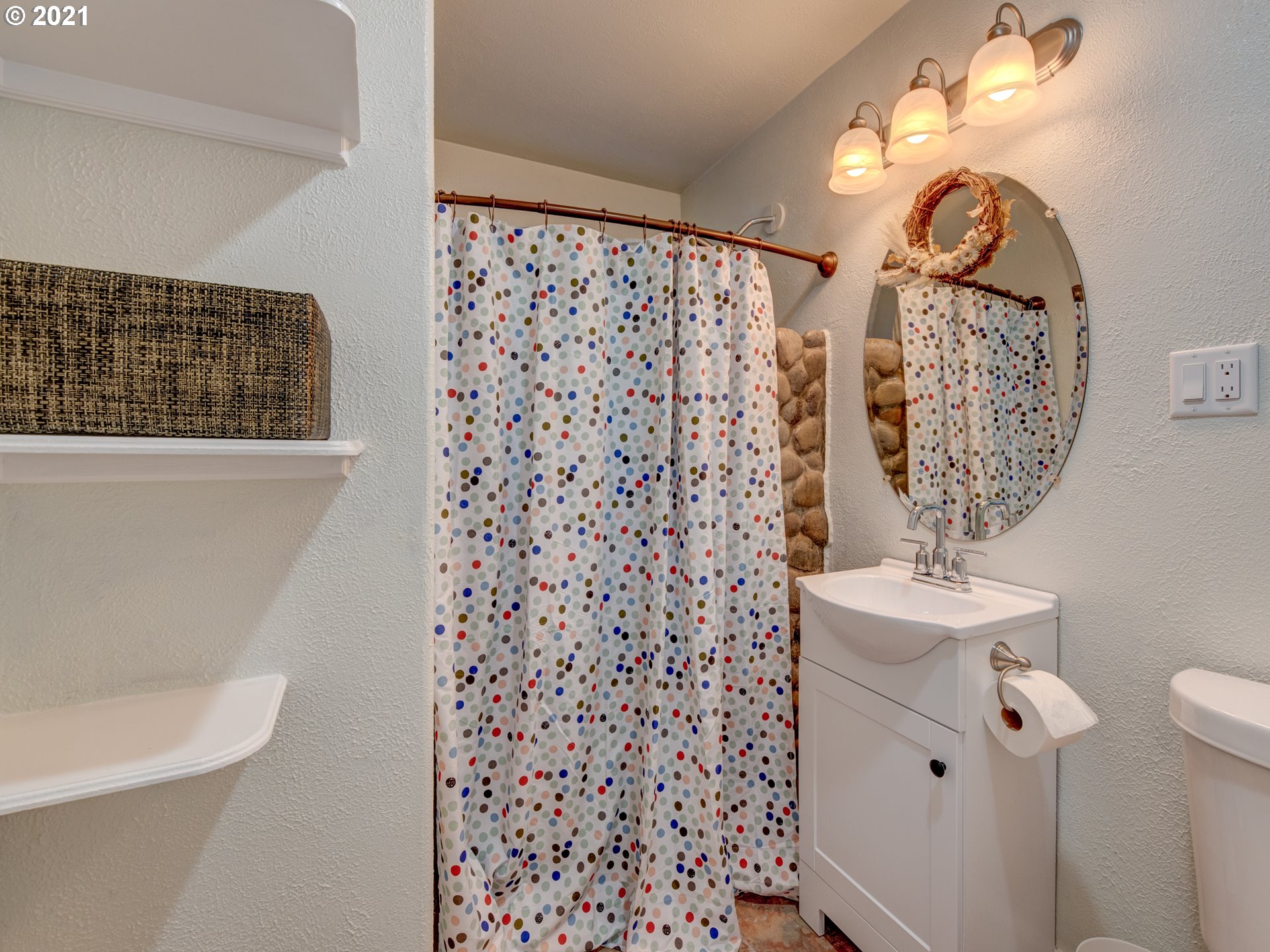 82039 Chickaree Road Lowell, OR 97452 - Photo 17 of 30 a bathroom with a sink a toilet and shower curtain