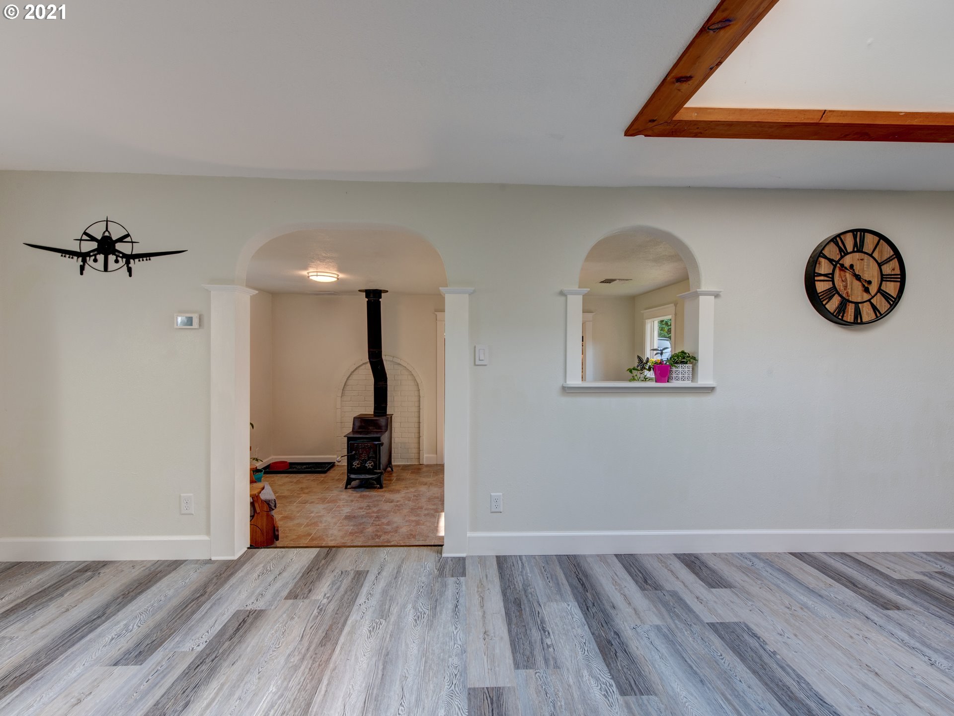 82039 Chickaree Road Lowell, OR 97452 - Photo 10 of 30 a view of a room with wooden floor and a ceiling fan
