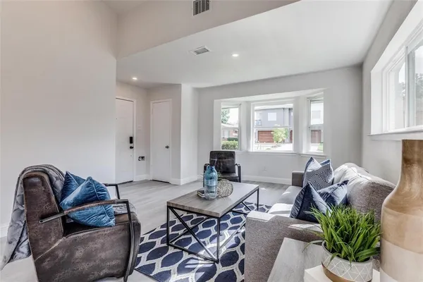 a living room with furniture and window