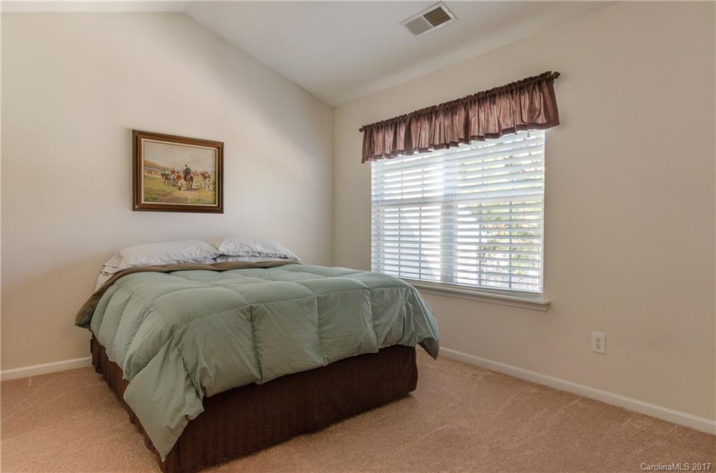11642 Rabbit Ridge Road, Unit 2073 Charlotte, NC 28270 - Photo 14 of 24 a bedroom with a bed and window