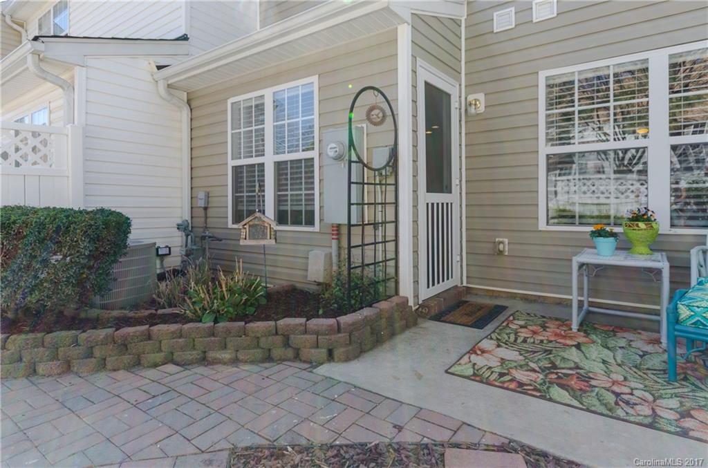 11642 Rabbit Ridge Road, Unit 2073 Charlotte, NC 28270 - Photo 22 of 24 a front view of a house with a yard