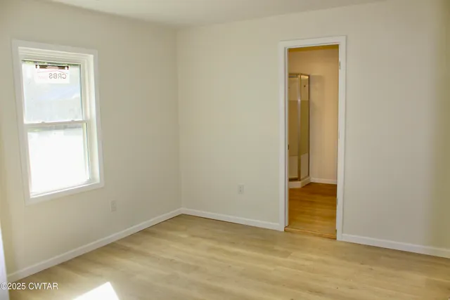 an empty room and window