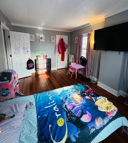 a view of a room with gym equipment and a window