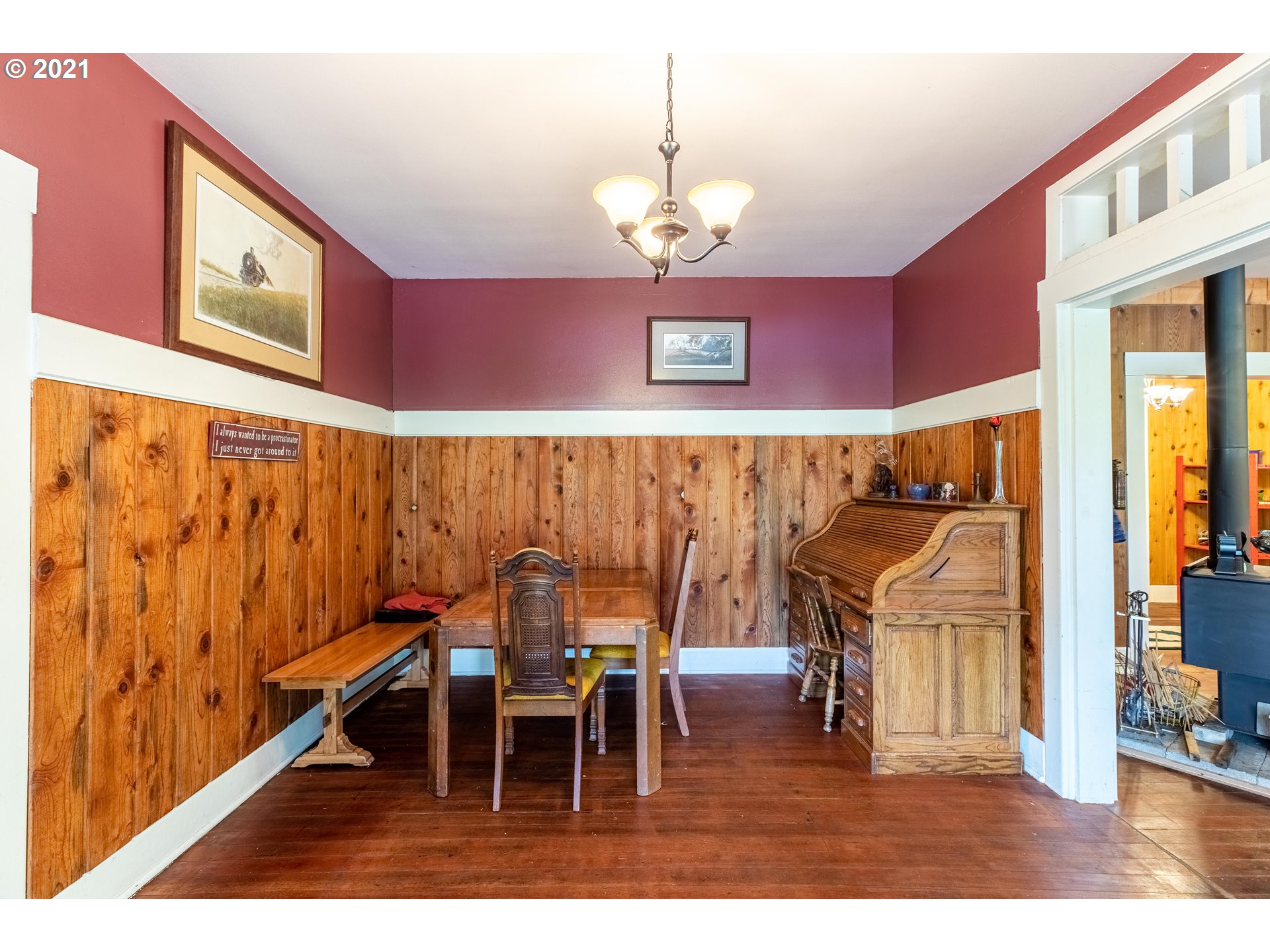 438 Soup Creek Road Reedsport, OR 97467 - Photo 16 of 30 a view of a dining room with furniture and wooden floor