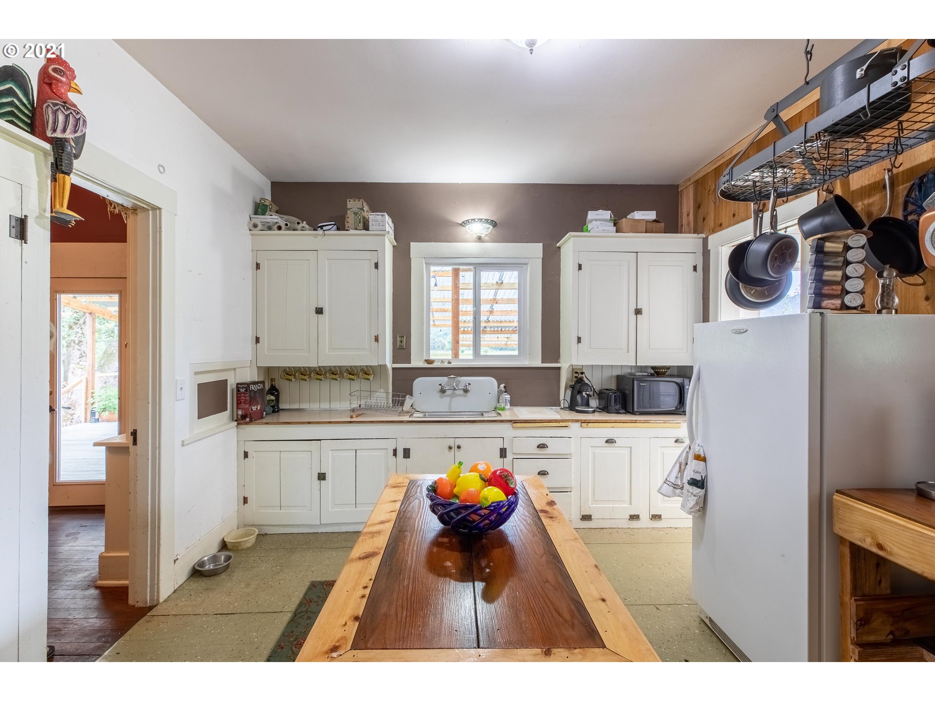 438 Soup Creek Road Reedsport, OR 97467 - Photo 18 of 30 a kitchen with a refrigerator and a stove