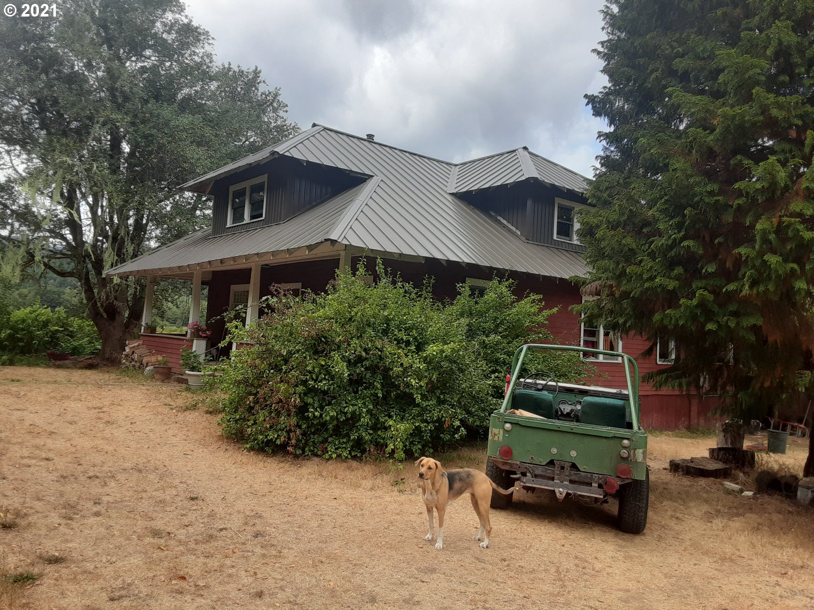 438 Soup Creek Road Reedsport, OR 97467 - Photo 4 of 30 a car parked in front of a house