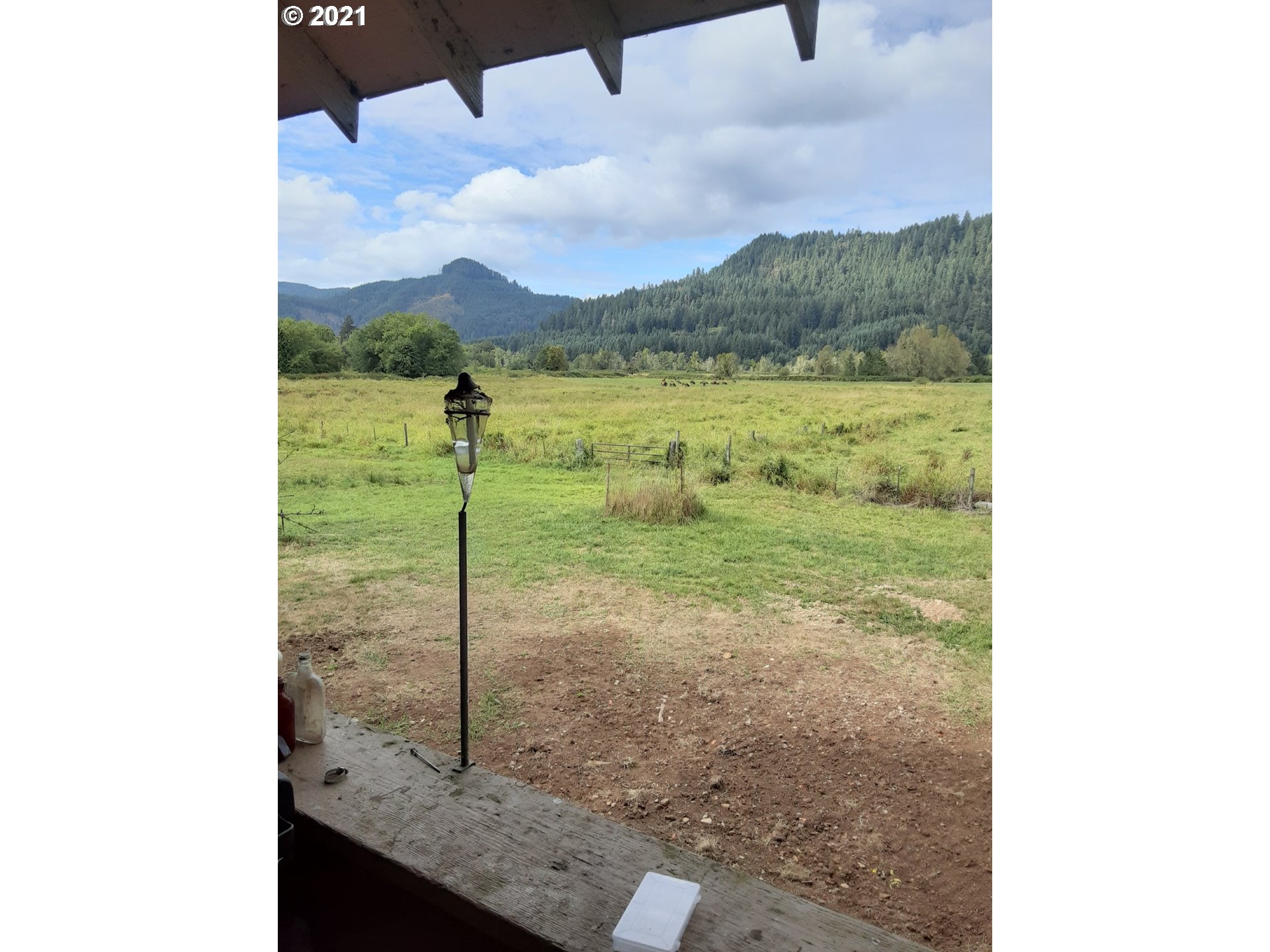 438 Soup Creek Road Reedsport, OR 97467 - Photo 6 of 30 a view of a lake from a window