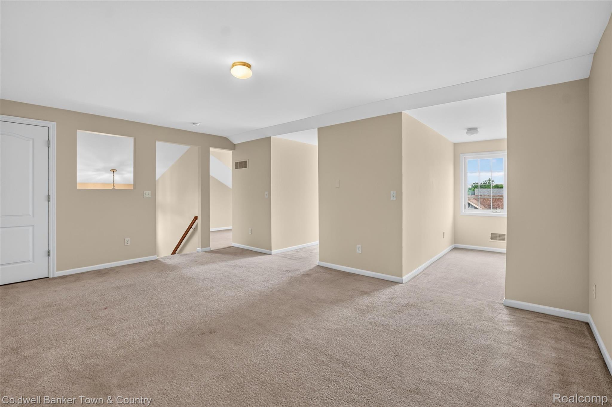 1725 Town Commons Drive Howell, MI 48855 - Photo 43 of 53 Spacious carpeted room featuring neutral wall tones, white trim, and recessed lighting