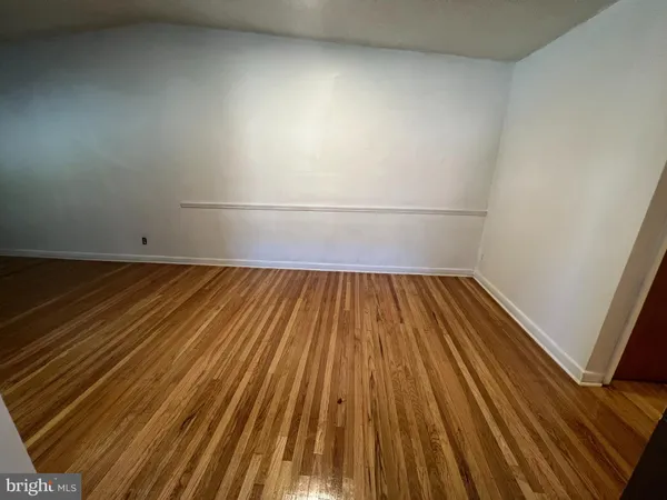 a view of wooden floor in a bathroom