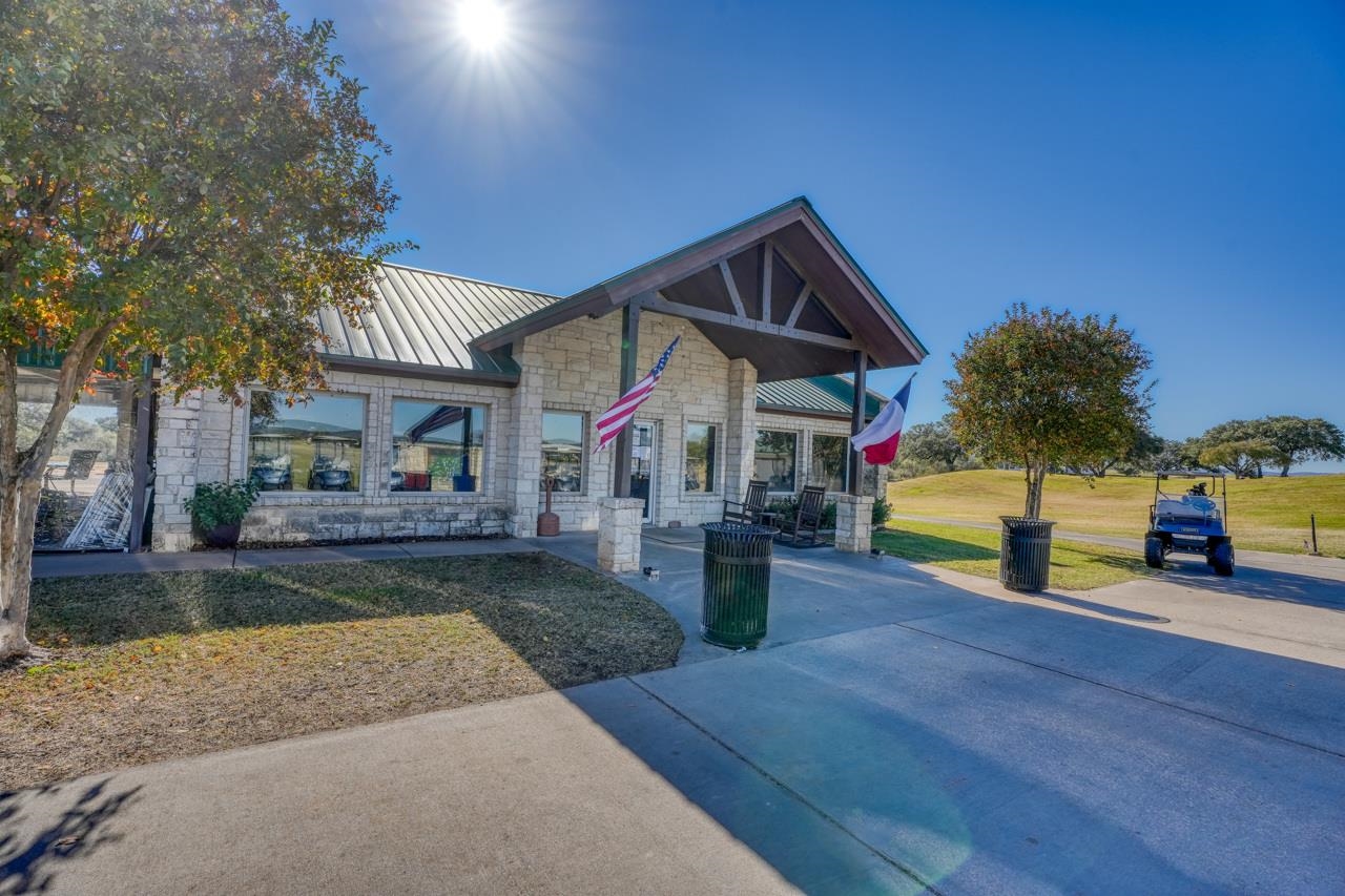 220 Sandia Loop Kingsland, TX 78639 - Photo 7 of 7 a front view of a house with a garden and patio
