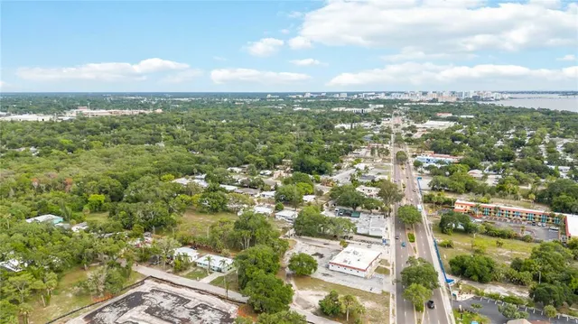 an aerial view of residential building with green space