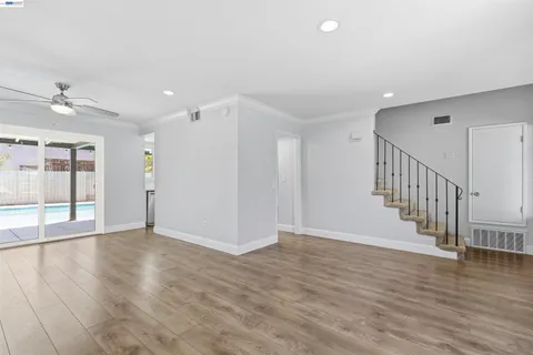 a view of an entryway with wooden floor