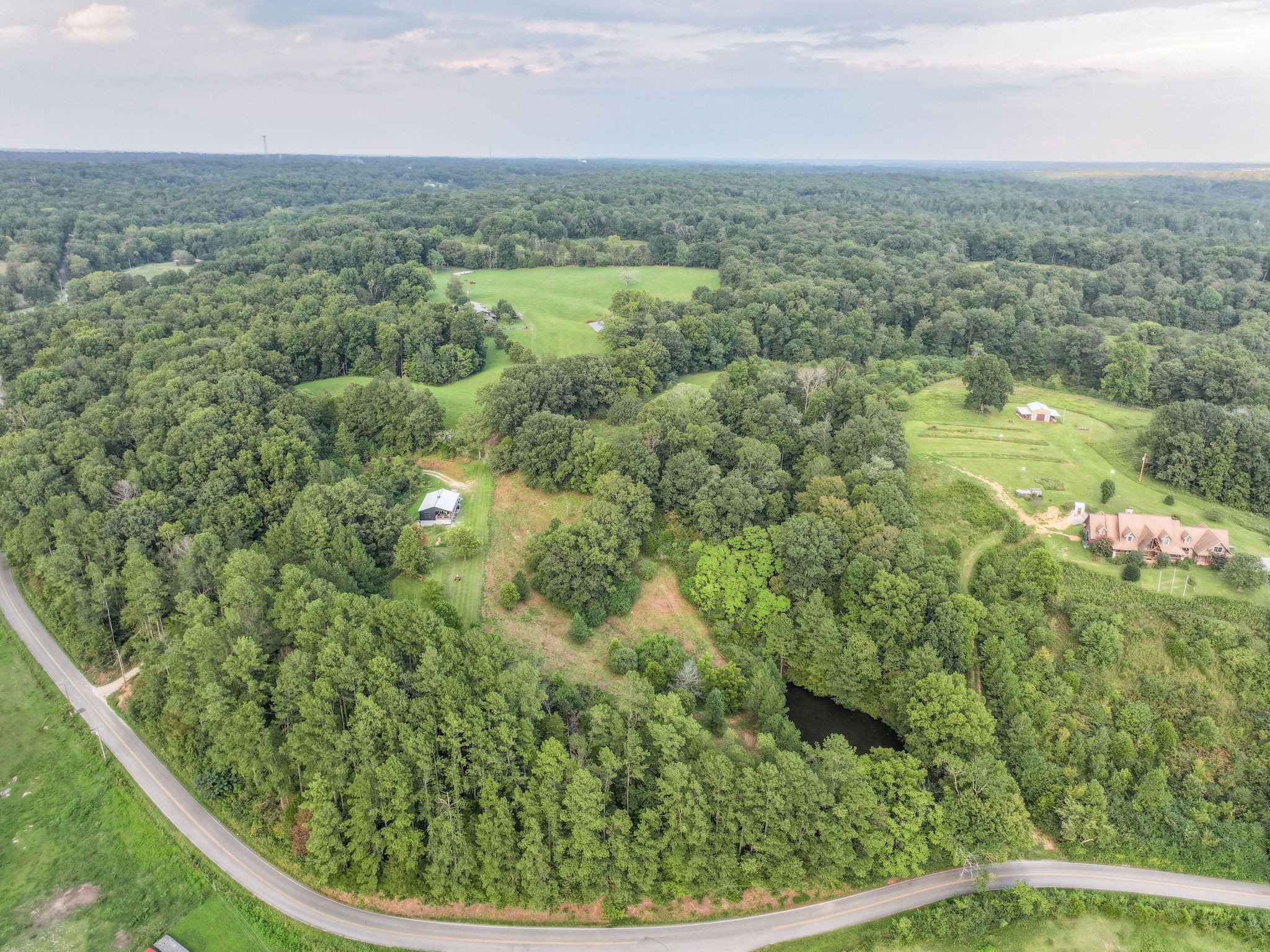 0 South Eno Road Dickson, TN 37055 - Photo 6 of 7 an aerial view of residential houses with outdoor space and trees