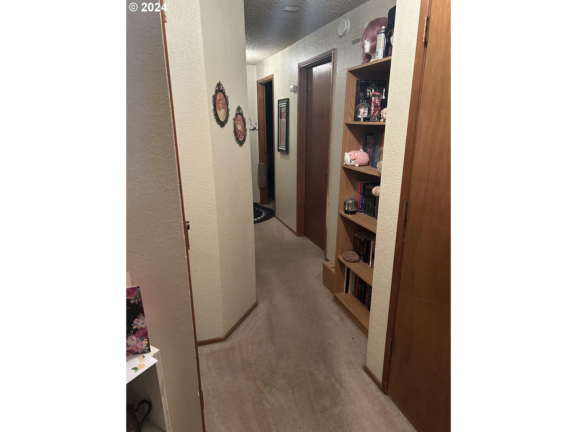4807 Daisy Street Springfield, OR 97478 - Photo 12 of 12 a view of a hallway with wooden shelves