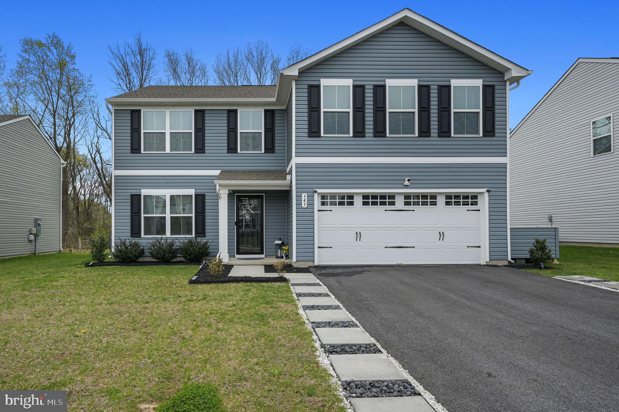 343 Sedimentary Rock Road Dover, DE 19904 - Photo 1 of 27 a front view of a house with a yard