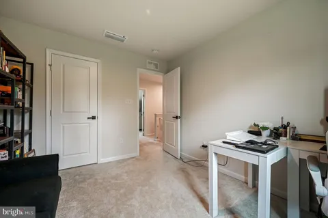a kitchen with a stove and a refrigerator